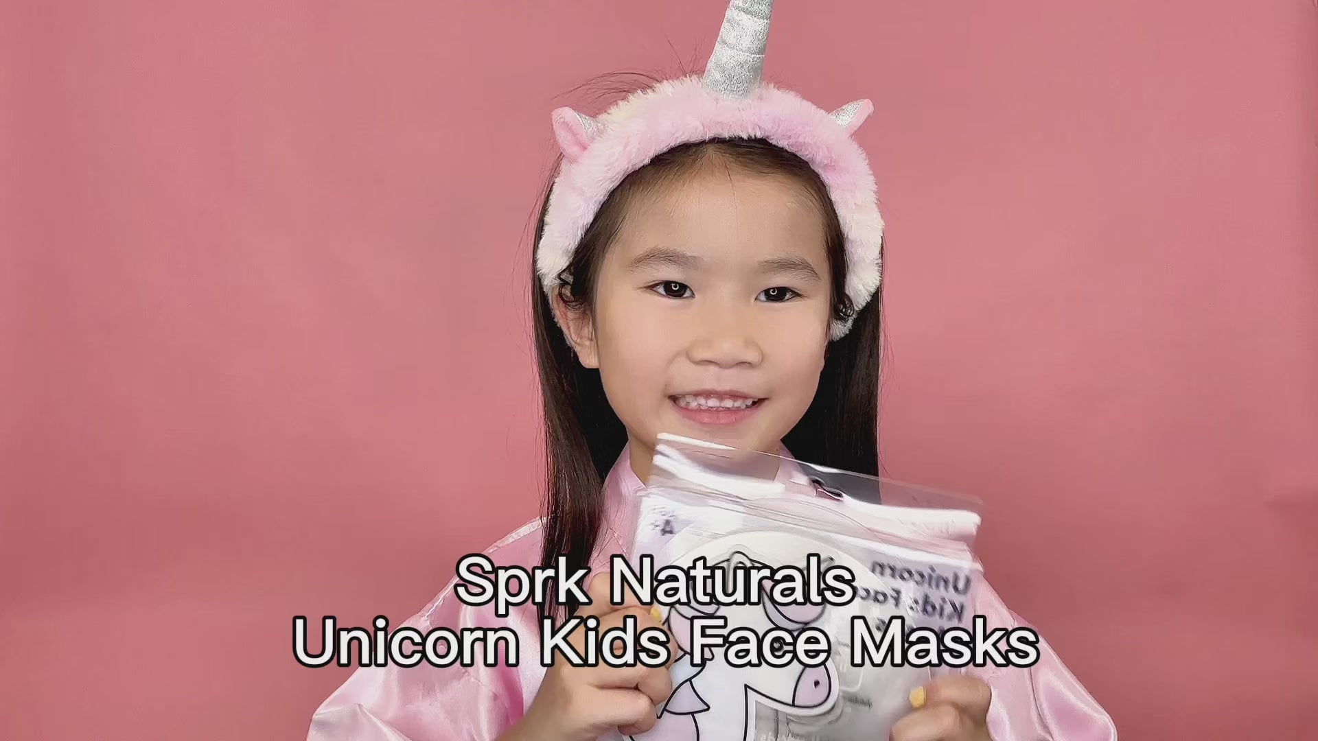 Load video: Little girl demonstrates unicorn spa masks - perfectly fits cheek and forehead, great for spa parties, birthdays, sleepovers. Put one each cheek, remove in 10-15 mins, no rinse needed.